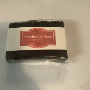 Natural handmade soap wrapped in labeled packaging.